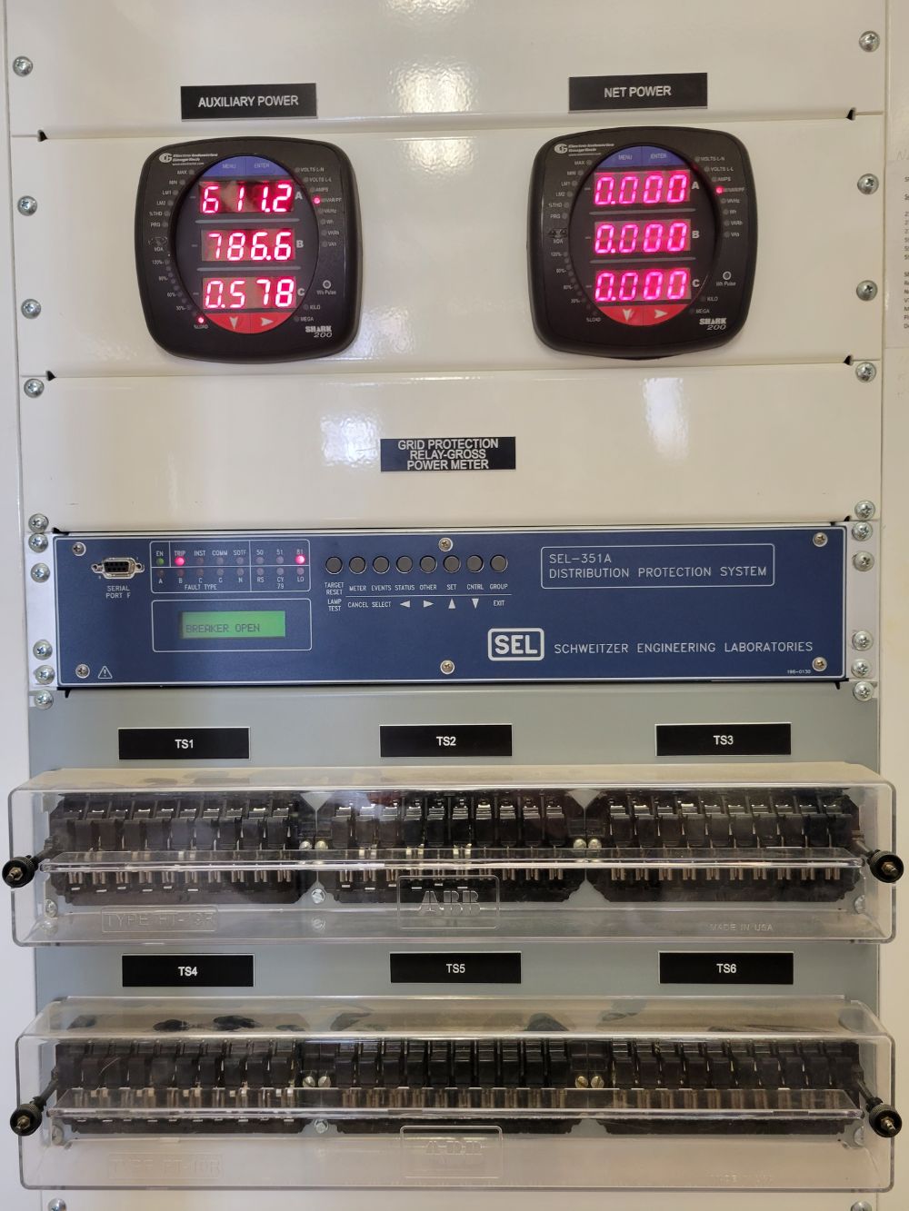 Green electric vehicle charging logo painted on asphalt